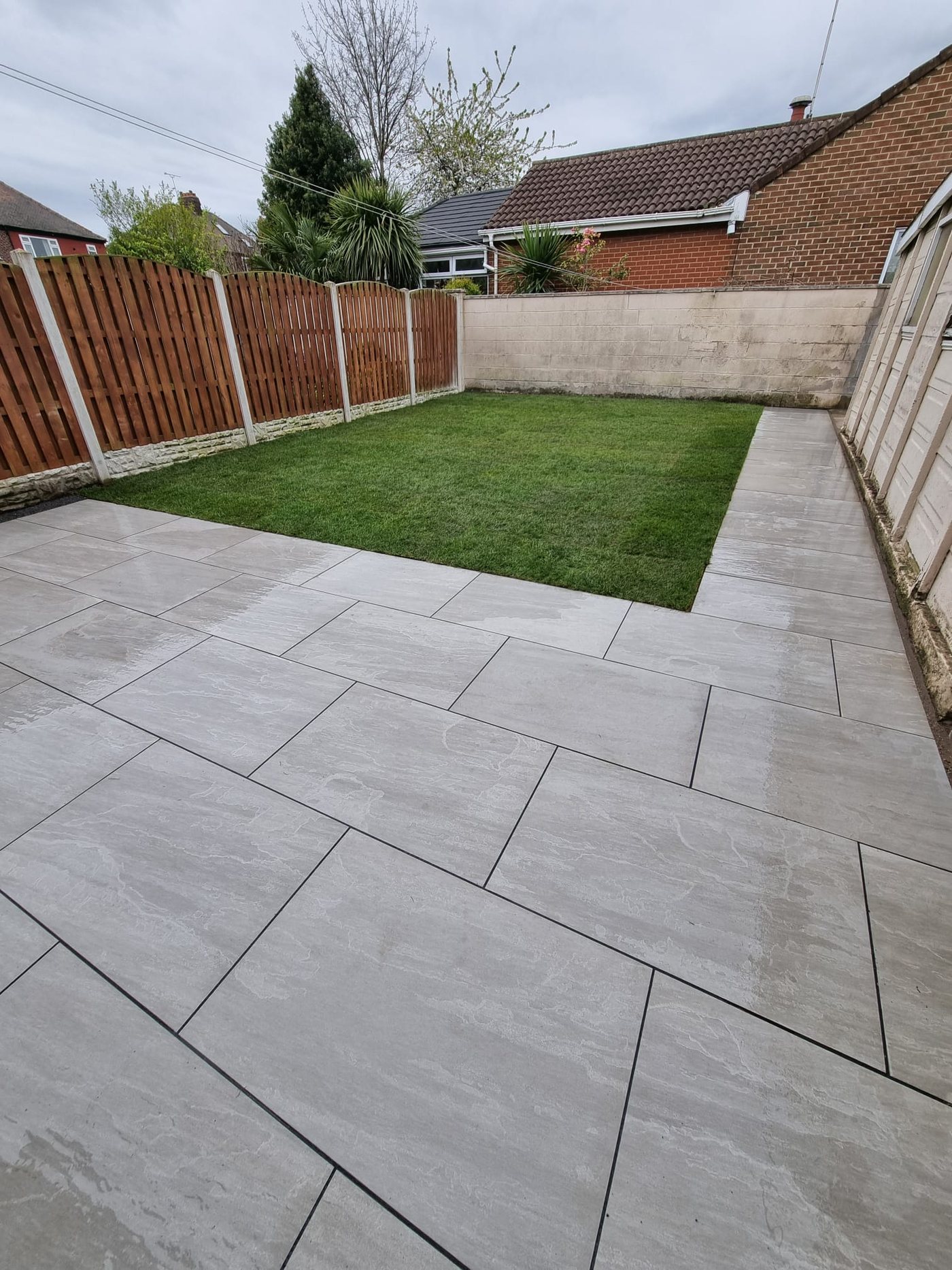 Porcelain patio and new lawn by Pinkerton Property